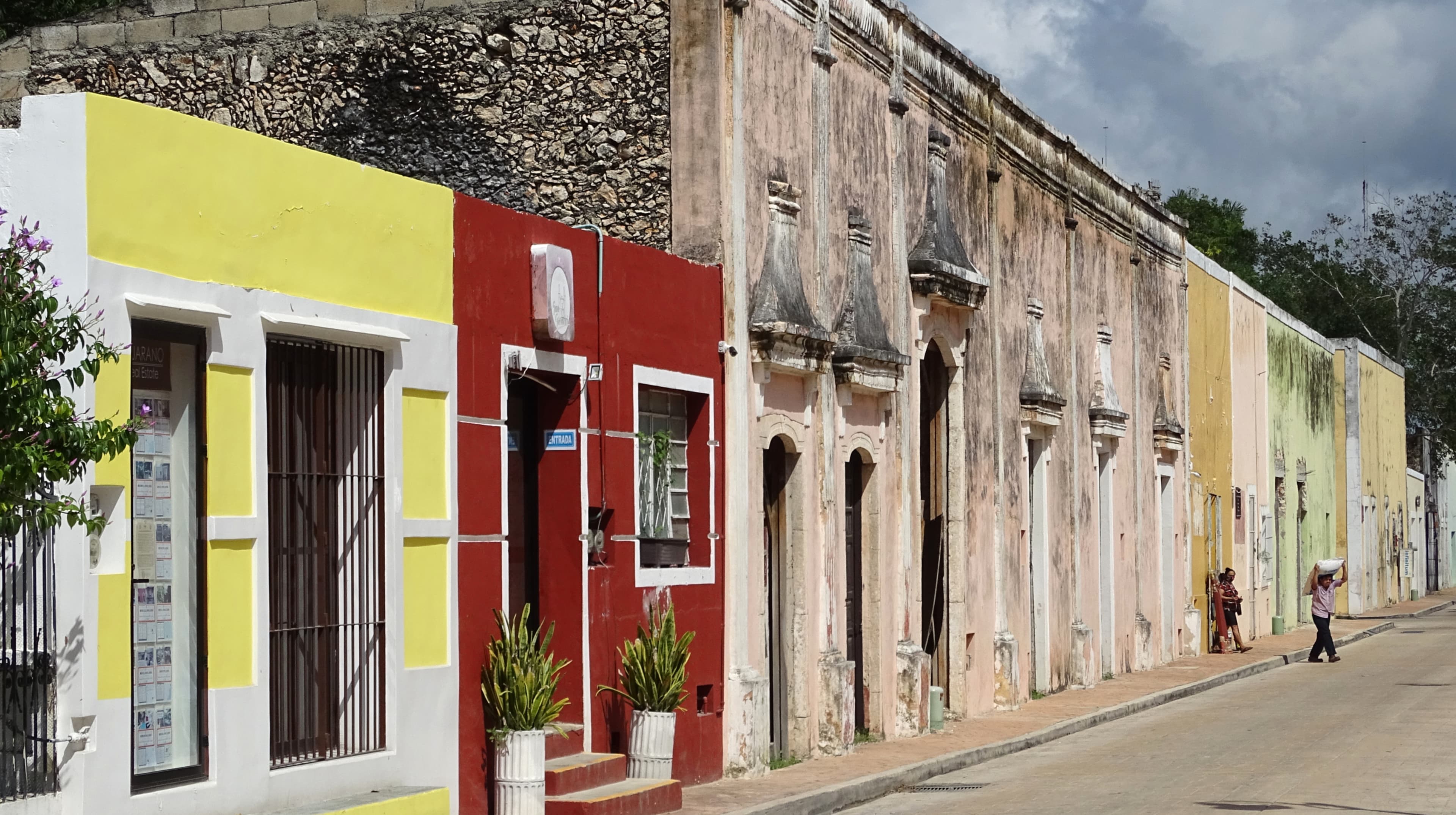 Pastel colonial facades along a quiet street in Valladolid